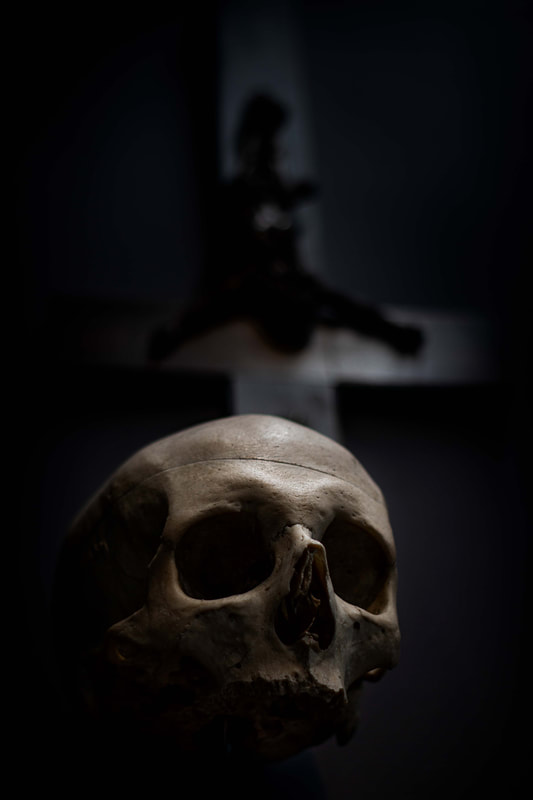 dark photography interior decoration human skull crucifix tattoo studio everblack